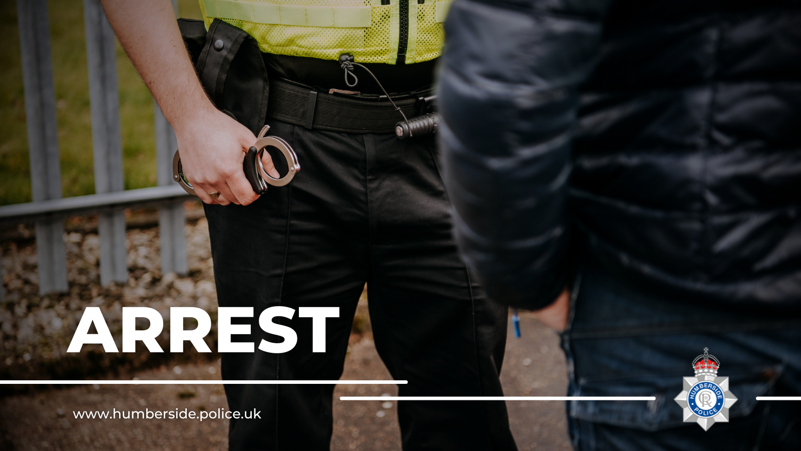 Close up of officer making arrest at the roadside