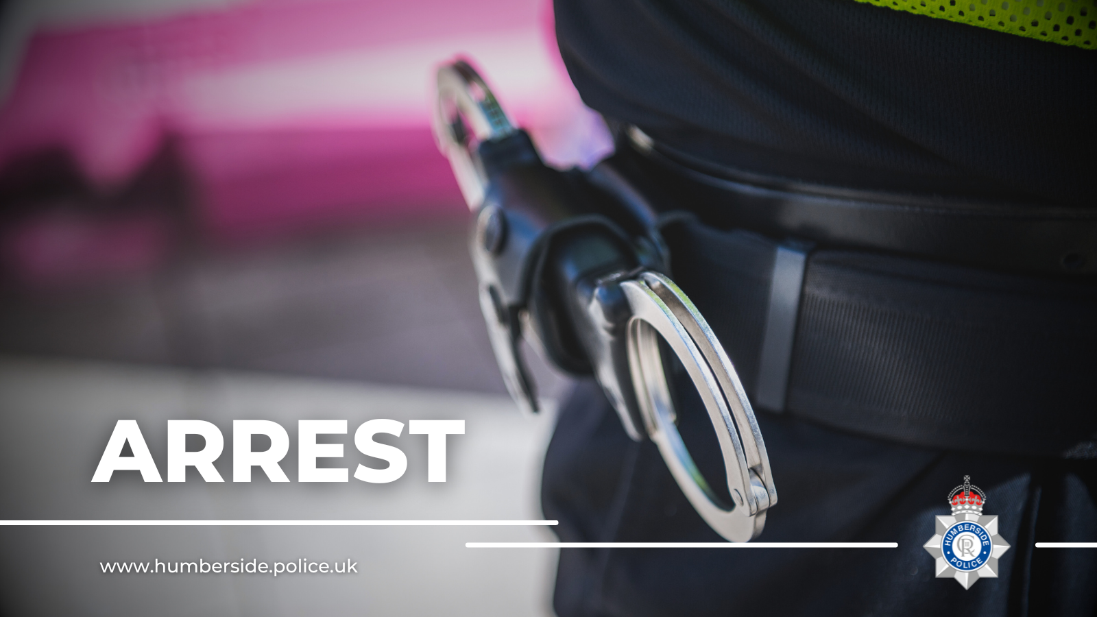 Close up of handcuffs holstered on officers belt