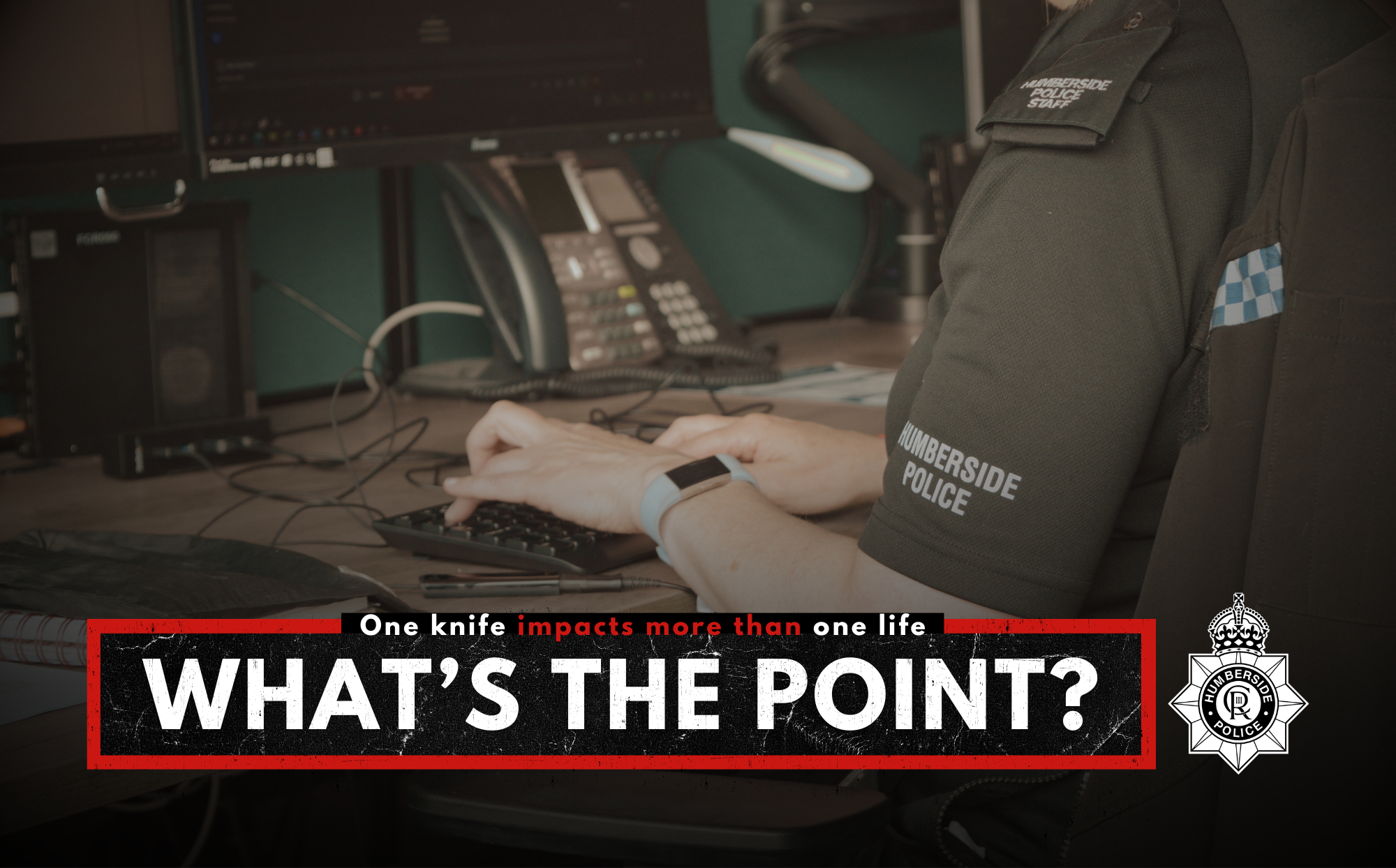 Image of officer at desk