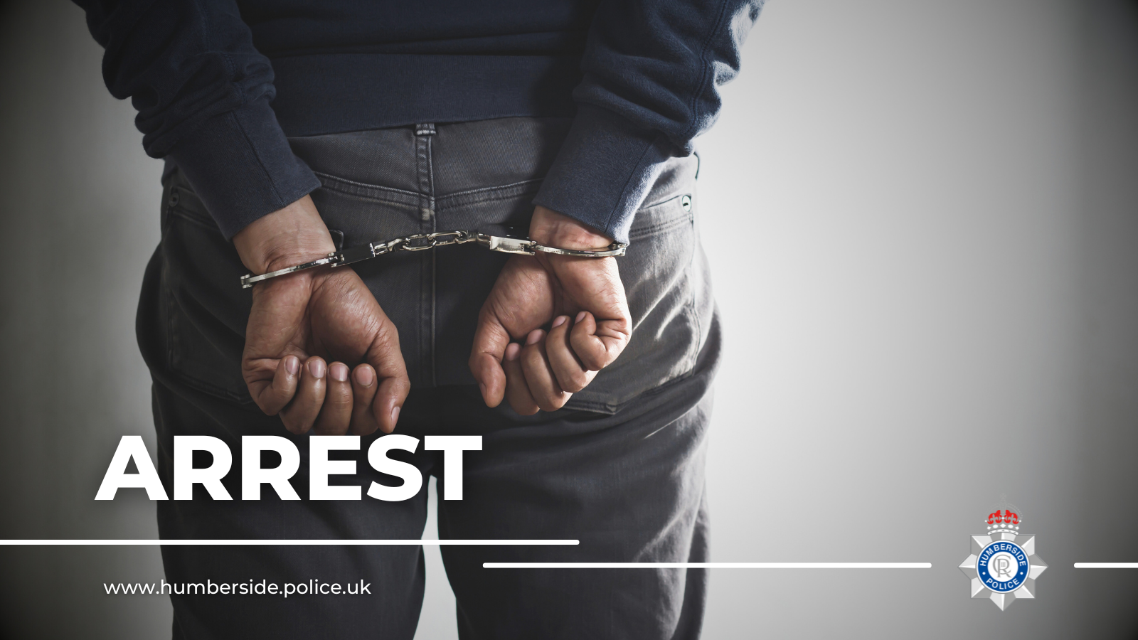 Close up image of man in handcuffs
