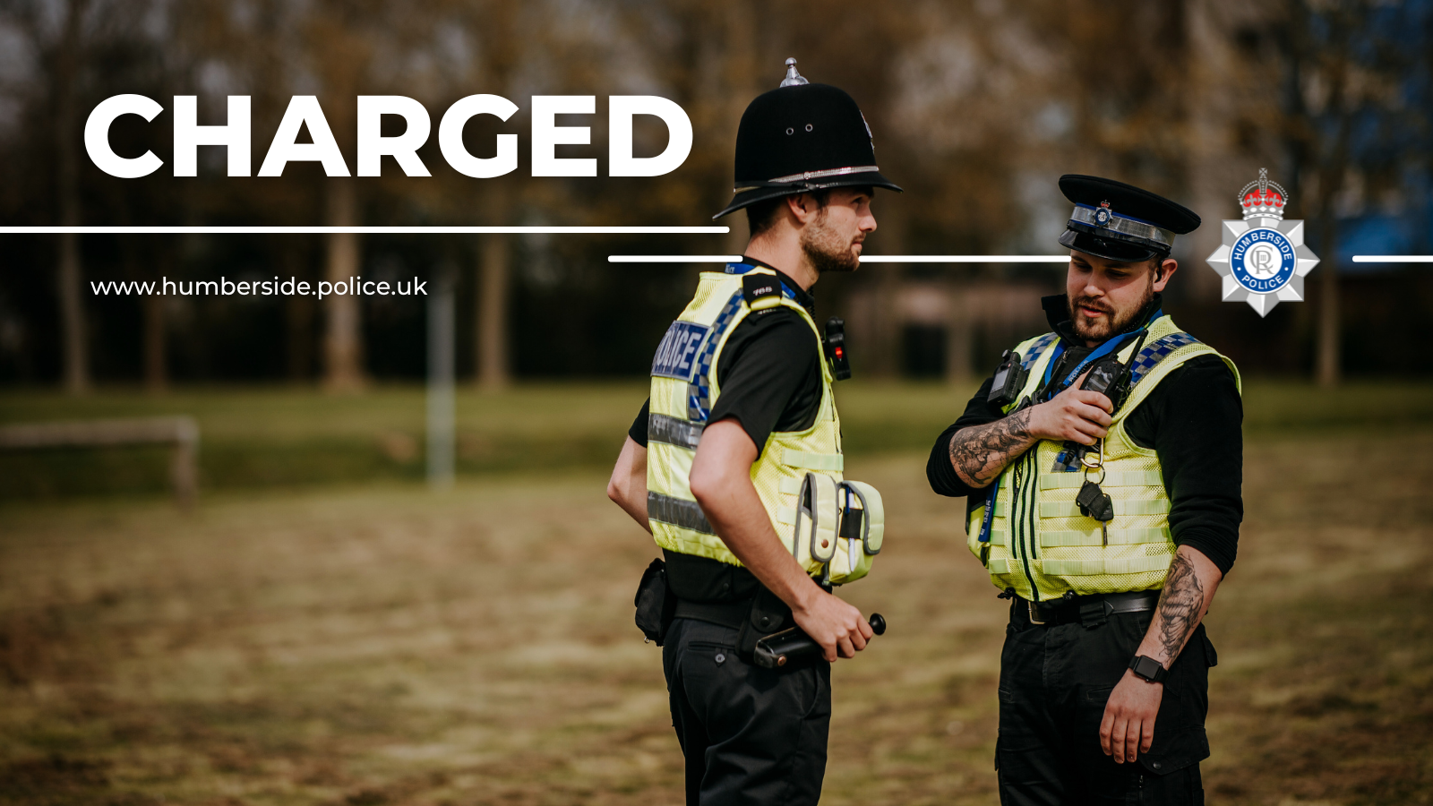 Image of two police officers conducting enquiries
