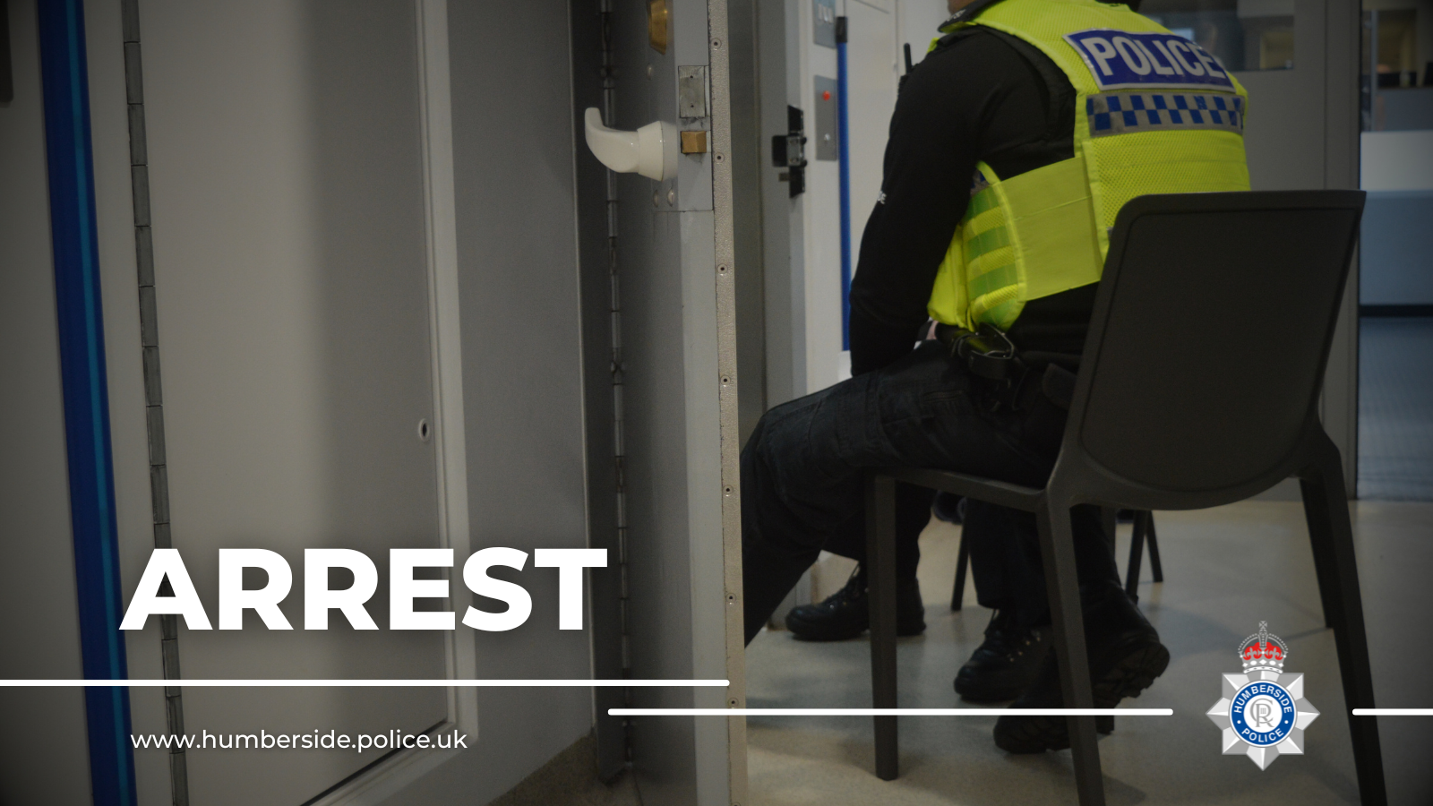Image of officer on cell watch in custody