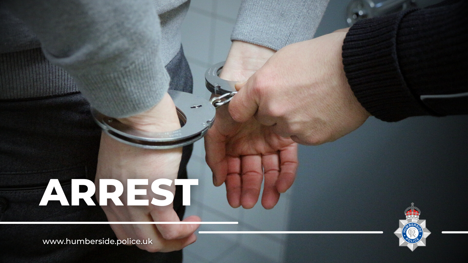 Close up of someone being arrested