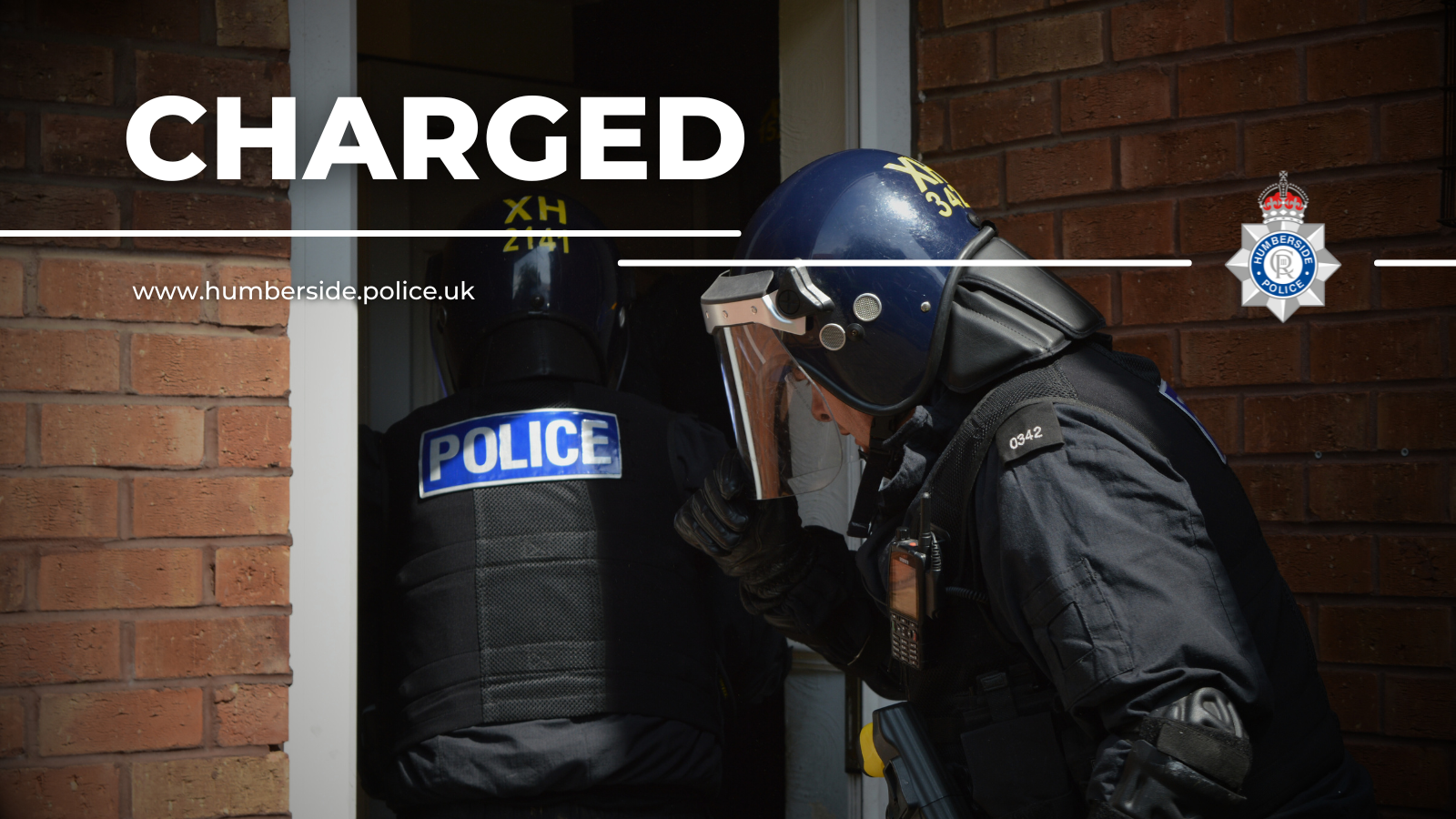 Image of Op Shield officers conducting arrest warrant at house