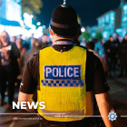 Police officer patrolling night time economy