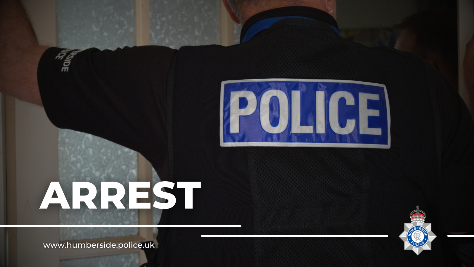 Image of police officer outside address