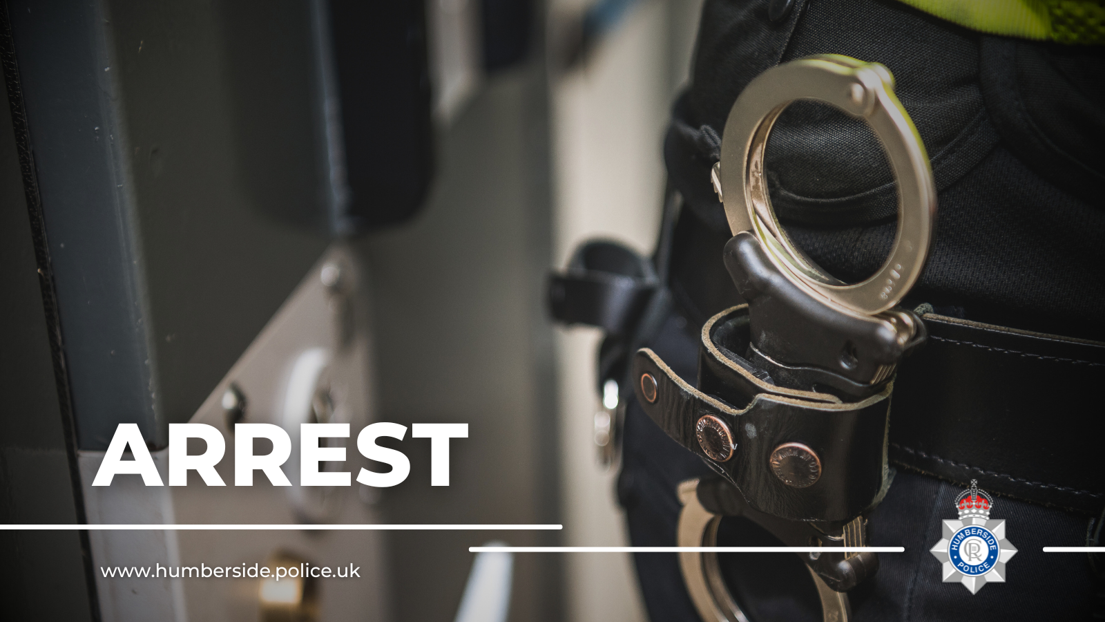 Close up image of officer with handcuffs