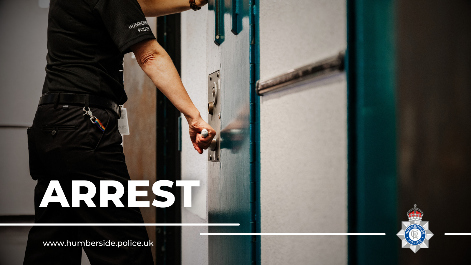 Image of detention officer closing cell door
