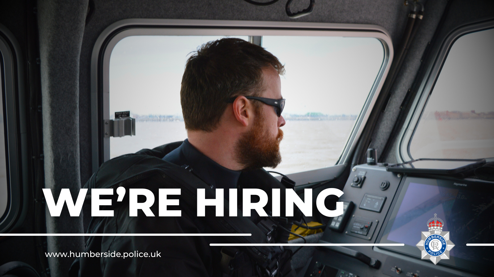 Image of police officer inside police boat