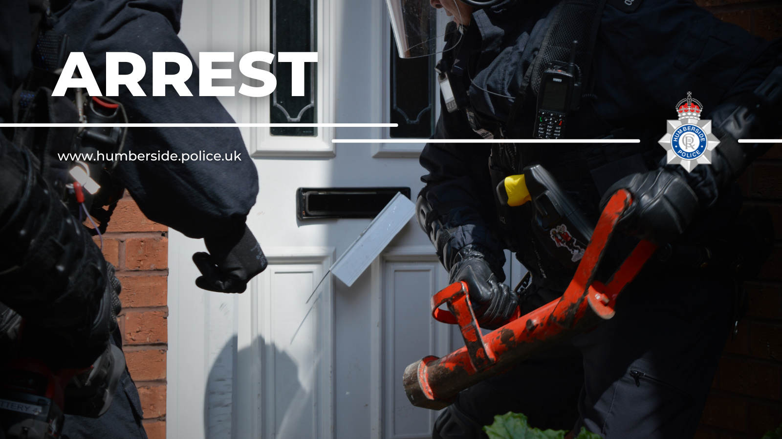 Image of officers executing warrant